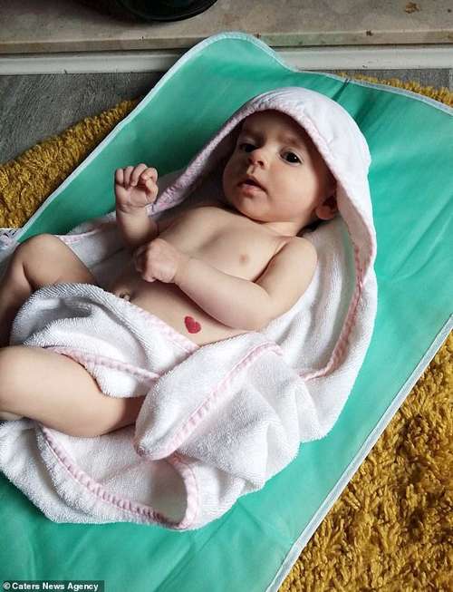 Jayne Welch, from Stoke on Trent, Staffordshire, said midwives 'couldn't believe it' when they spotted the perfectly symmetrical heart on Jorgia's left side shortly after she was born last February