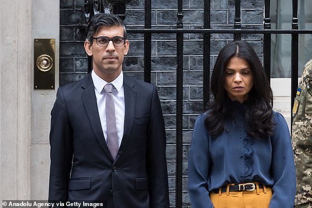 British Prime Minister Rishi Sunak and his wife Akshata Murty take part in a national minute of silence to mark the one-year anniversary of Russia's invasion of Ukraine