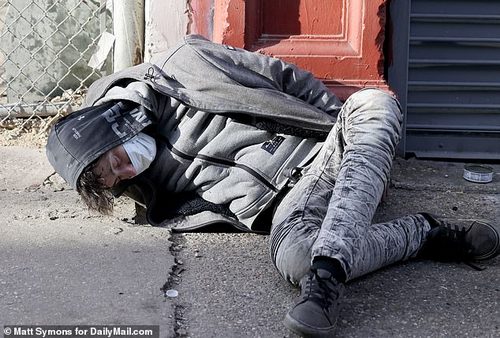 A person is pictured passed out from a drug called xylazine, a tranquilizer that is now found in 90 per cent of all Philadelphia's heroin