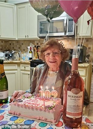 And above on her 102nd birthday. Her daughter Phyllis Scotto says she has survived Covid twice