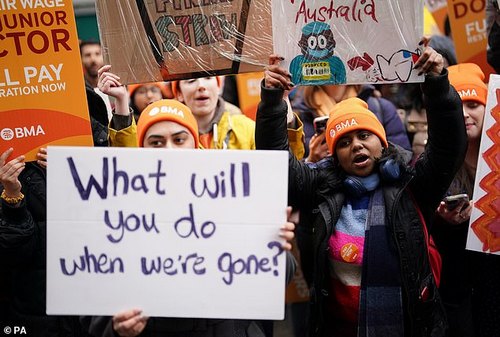 NHS junior doctors take part in a march and rally in the centre of Birmingham on April 14, holding signs asking 'What will you do when we're gone?' and suggesting moves to Australia